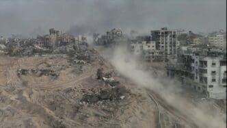 Tank driving with dust in al-shati refugee camp, Gaza, aerial Drone view over North Gaza in the war with Israel. Gaza-March,20,2024