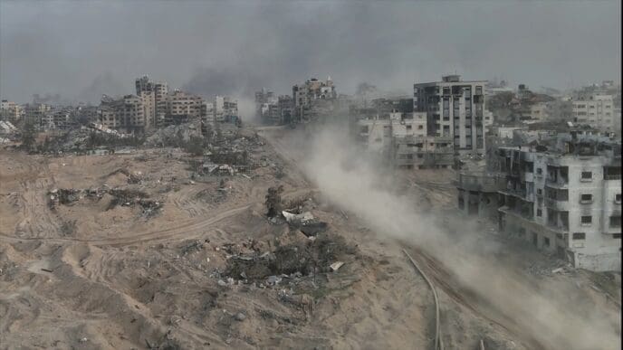 Tank driving with dust in al-shati refugee camp, Gaza, aerial Drone view over North Gaza in the war with Israel. Gaza-March,20,2024