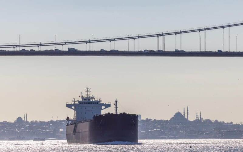 Tanker ship pass through the Bosporus with Bosphorus Bridge in Istanbul Turkey