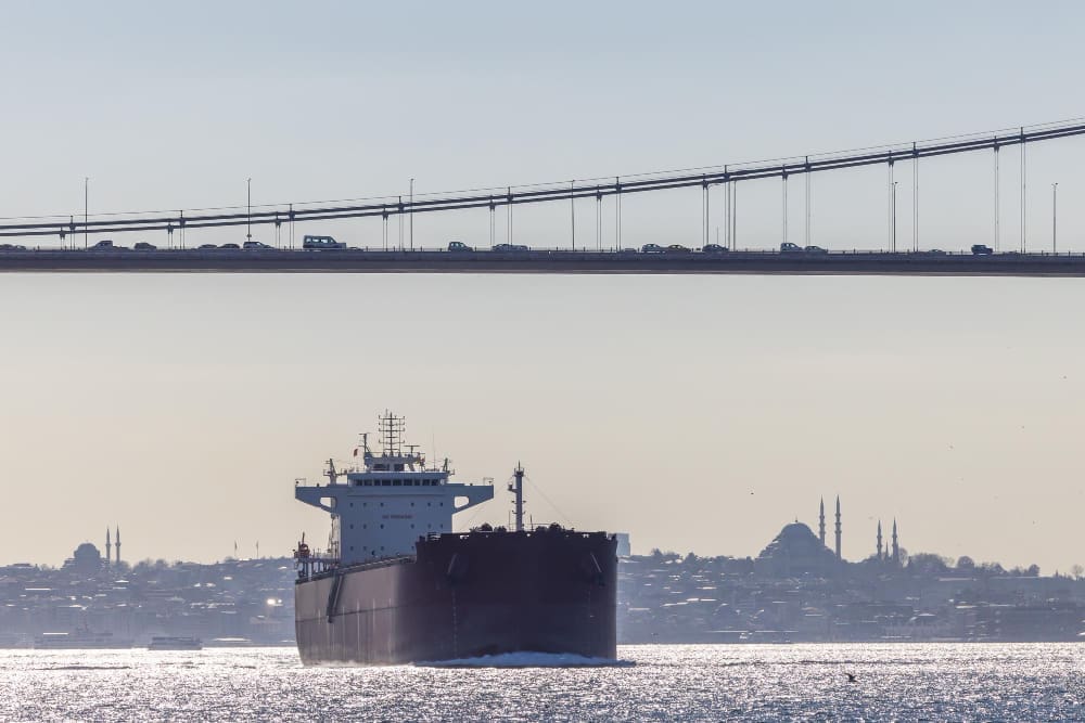 Tanker ship pass through the Bosporus with Bosphorus Bridge in Istanbul Turkey
