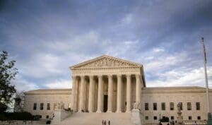 US Supreme Court building against cloudy sky