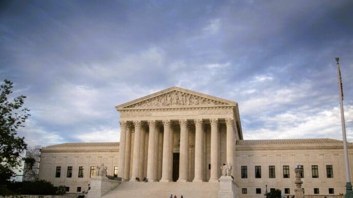 US Supreme Court building against cloudy sky