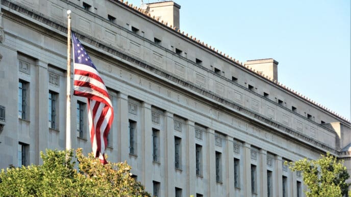Washington D.C. USA. June 3, 2017. Department of Justice building located in Washington D.C. on a nice sunny day with the United States Flag.