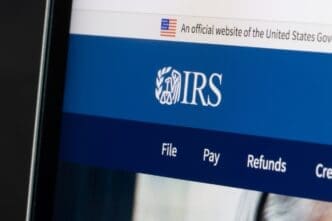 Website homepage of the Internal Revenue Service (IRS) is seen on a laptop computer. IRS is the revenue service of the United States federal government. By Shutterstock.com - Tada Images