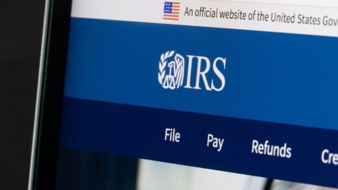 Website homepage of the Internal Revenue Service (IRS) is seen on a laptop computer. IRS is the revenue service of the United States federal government. By Shutterstock.com - Tada Images