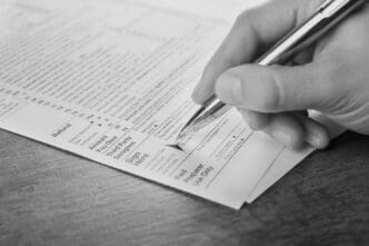 A man filling a tax form