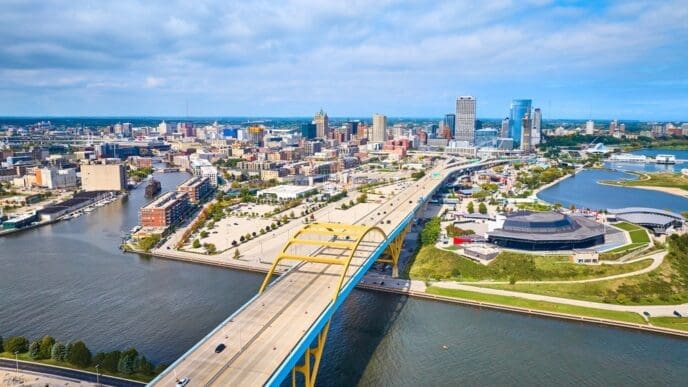 Aerial View of Milwaukee Bridge, Stadium, and Urban Skyline. By Shutterstock.com - Nicholas J Klein