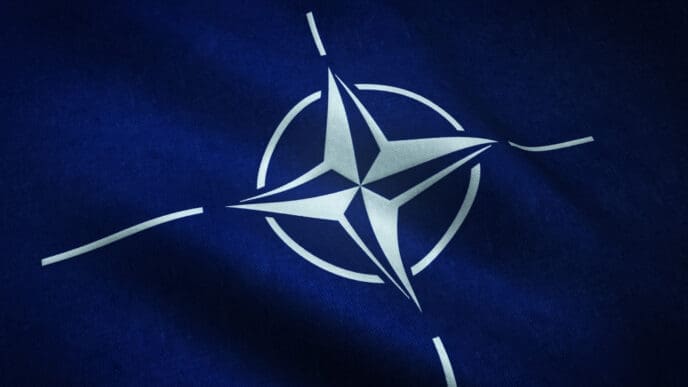 Closeup shot of the waving flag of The North Atlantic Treaty Organization - NATO