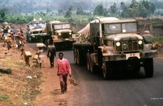 Convoy of American military vehicles bring fresh water from Goma to Rwandan refugees located at camp Kimbumba, Zaire in August 1994