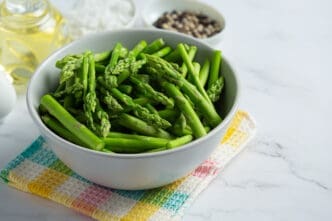 Fresh green asparagus in bowl
