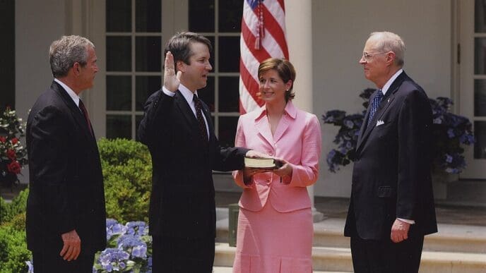 Kavanaugh is sworn into the D.C. Circuit by Justice Anthony Kennedy as his wife holds the Bible and President Bush looks on, 2006