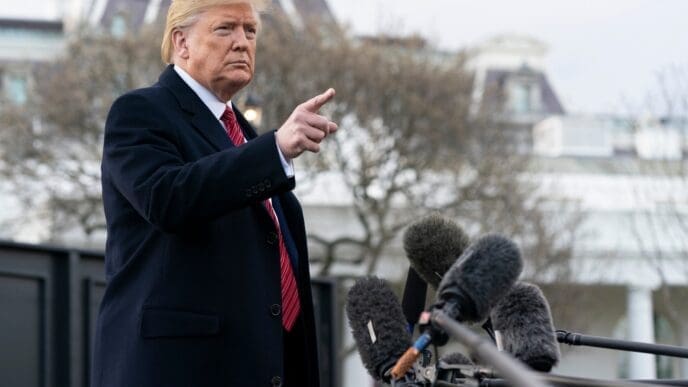 President Trump speaks with members of the press prior to boarding Marine One to begin his trip to South Carolina. Washington, DC - February 28, 2020. By Shutterstock.com