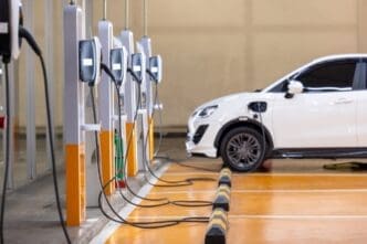 Socket for charging electric vehicle (EV) batteries at a charging station located in a parking area. By Shutterstock.com - Darunrat Wongsuvan
