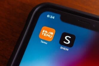 Temu and Shein app icons seen in an iPhone. By Shutterstock.com - Koshiro K