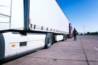 Truck driver inspecting truck long vehicle before driving