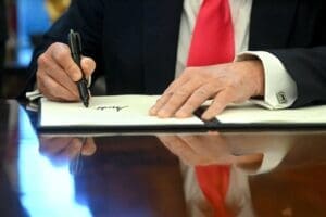 US President Donald Trump signs an Executive Order at the Oval Office of the White House on February 25, 2025. By Shutterstock.com - Jimwatson