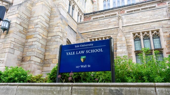 Yale University. Yale Law School sign and coat of arms at Sterling Law Building. New Haven, Connecticut. By Shutterstock.com - Michael Vi