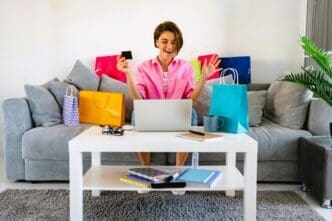 Young happy woman purchasing a lot of goods