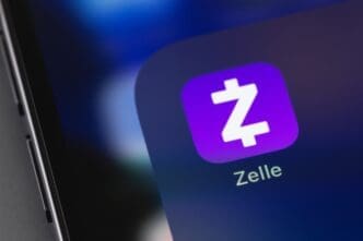 Zelle mobile app on a screen smartphone iPhone closeup. Zelle is a US-based digital payments network, payment service. By Shutterstock.com - Primakov