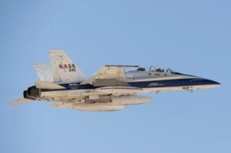 A NASA F/A-18 research aircraft flies above California near NASA’s Armstrong Flight Research Center in Edwards, California, testing a commercial precision landing technology for future space missions
