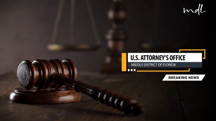 A judge's gavel rests on a wooden desk with the scales of justice blurred in the background. A text overlay reads: "U.S. Attorney's Office, Middle District of Florida, Breaking News."