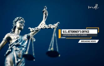 A statue of Lady Justice holding her scales on a blue background, with a text overlay reading: "U.S. Attorney's Office, Southern District of Florida, Breaking News."