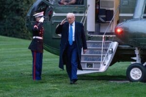 Washington DC, United States, April 6 2025 President Donald Trump salutes a Marine as he steps off Marine 1