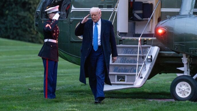 Washington DC, United States, April 6 2025 President Donald Trump salutes a Marine as he steps off Marine 1