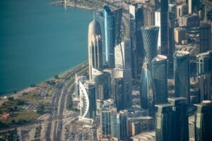 Doha, Qatar - December 12, 2016: Aerial view of city skyline from a flying airplane over the Qatar capital.