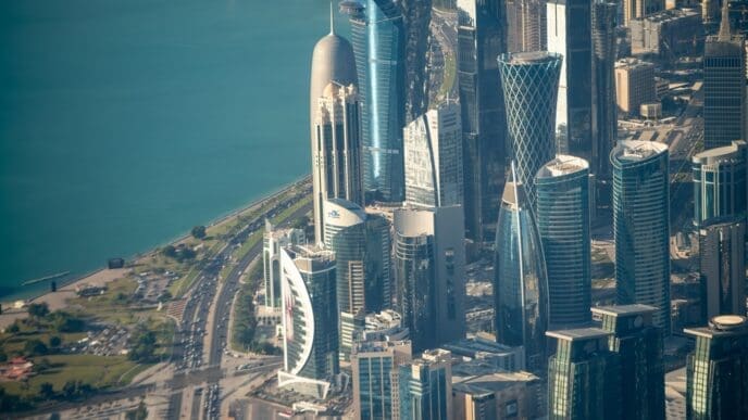 Doha, Qatar - December 12, 2016: Aerial view of city skyline from a flying airplane over the Qatar capital.
