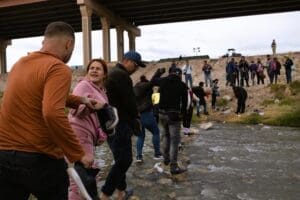 Juarez, Mexico, 11-15-2022: Venezuelan migrants cross the Rio Grande to surrender to the border patrol with the intention of requesting asylum in the United States.