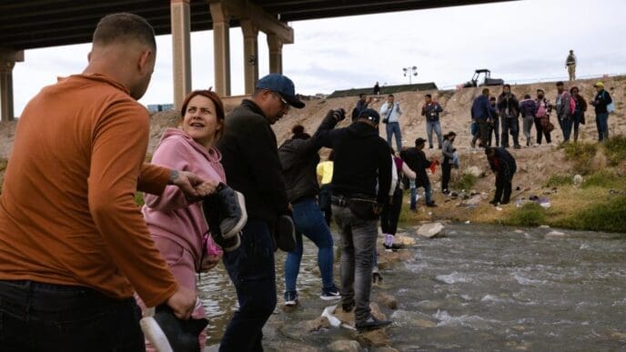 Juarez, Mexico, 11-15-2022: Venezuelan migrants cross the Rio Grande to surrender to the border patrol with the intention of requesting asylum in the United States.