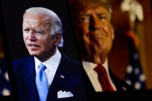 Democratic candidate Joe Biden is sharp in the foreground, while Republican candidate Donald Trump is blurred in the background, USA, December 16, 2024