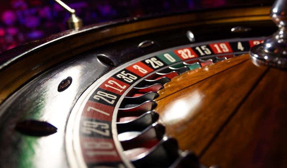 Casino roulette wheel close up ready to play and waiting for bets.