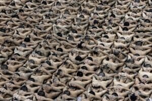 Detainees stand in formation before being escorted to their cells at a high-security facility in Tecoluca, El Salvador.