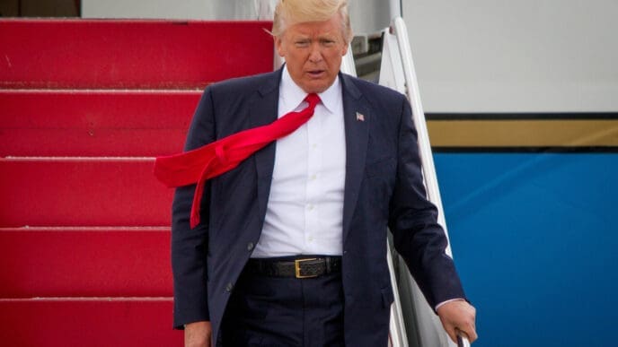 President Donald Trump disembarks Air Force One in Ronkonkoma, NY, Friday, July 28, 2017.