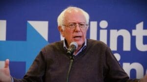 Senator Bernie Sanders speaks at a podium during a campaign rally for Hillary Clinton at Nashua Community College in New Hampshire in October 2016.