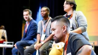 A conceptual image representing Global Entrepreneurship Week, showing a diverse group of innovators collaborating and networking at a vibrant event.