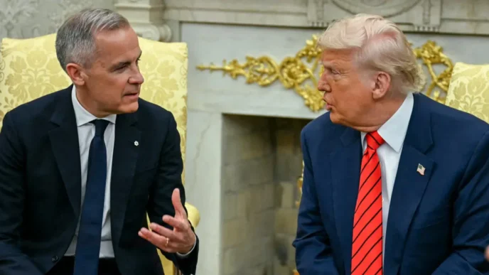 Mark Carney (left), wearing a dark suit and tie, is seated and gesturing while in discussion with U.S. President Donald Trump (right), who is also in a suit and red tie. They are in an ornate room.