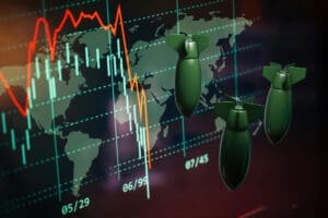 A conceptual image showing three large bombs superimposed on a world map that is overlaid with a volatile, declining stock market chart, symbolizing the economic impact of war.