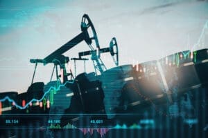 A conceptual image showing oil pumpjacks and barrels with a translucent overlay of a volatile financial stock chart and a world map, symbolizing the global oil market.