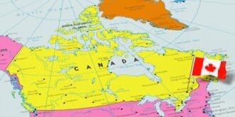 A colorful political map of Canada, highlighted in yellow, showing its provinces, territories, and major cities. A small 3D pin of the Canadian national flag is stuck into the map near the location of Ottawa.