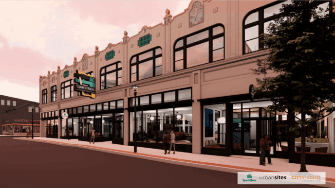 An architectural rendering of the SparkHaus building in Covington, Kentucky, showing a renovated two-story historic building with modern, glass-fronted retail spaces on the ground floor.