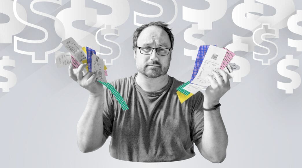 A worried man wearing glasses holds up a fan of long paper receipts in front of a background filled with large, faded dollar signs, symbolizing financial stress and economic concerns.