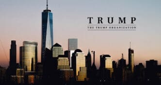 A silhouette of the Lower Manhattan skyline at dusk, featuring One World Trade Center, with a text overlay for "TRUMP" and "THE TRUMP ORGANIZATION" in the sky above.
