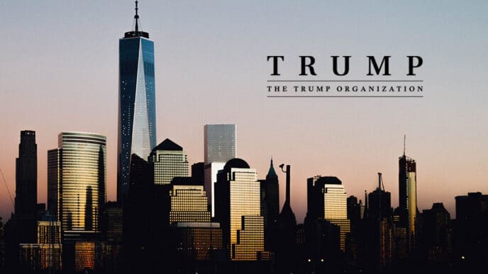 A silhouette of the Lower Manhattan skyline at dusk, featuring One World Trade Center, with a text overlay for "TRUMP" and "THE TRUMP ORGANIZATION" in the sky above.