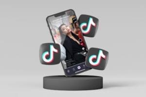 A smartphone displaying a social media app's video feed is shown floating above a dark cylindrical base, with three stylized musical note icons (TikTok logos) floating around it, all against a plain grey background.