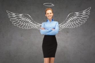 A smiling young businesswoman in professional attire is depicted with a conceptual overlay, such as a glowing shield icon, representing business and personal security.