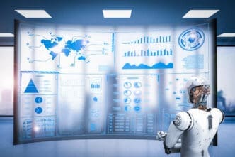 A white humanoid robot stands in front of a large, curved holographic screen displaying various blue-toned business intelligence dashboards, including world maps, bar charts, and pie charts.