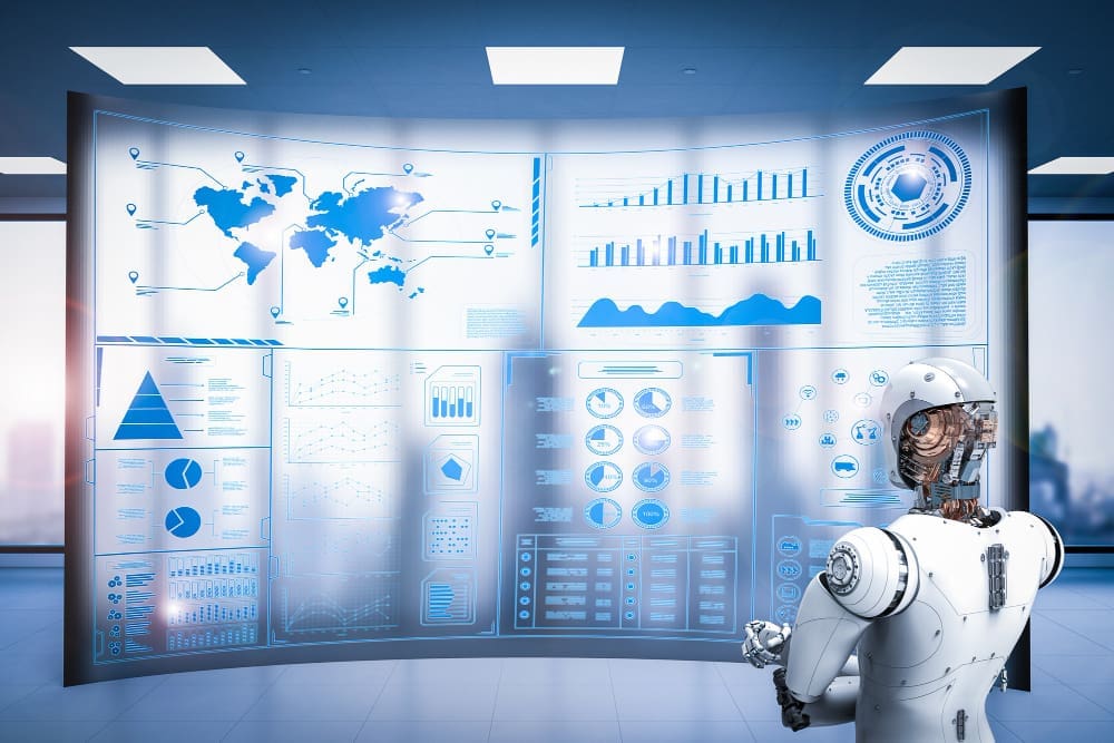 A white humanoid robot stands in front of a large, curved holographic screen displaying various blue-toned business intelligence dashboards, including world maps, bar charts, and pie charts.